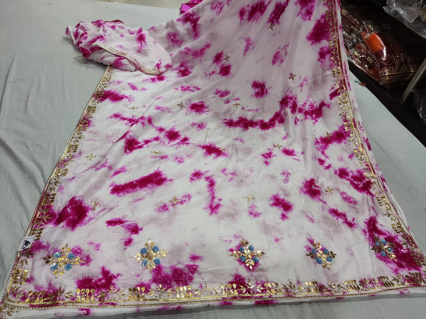 White Saree with Bold Fuchsia Tie-Dye Splashes and Heavy Gota Pallu